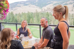 Group of golfers dining on patio at Black Mountain Grill